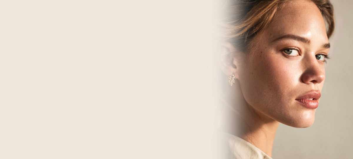 Model wearing AVENUE FALLS earrings